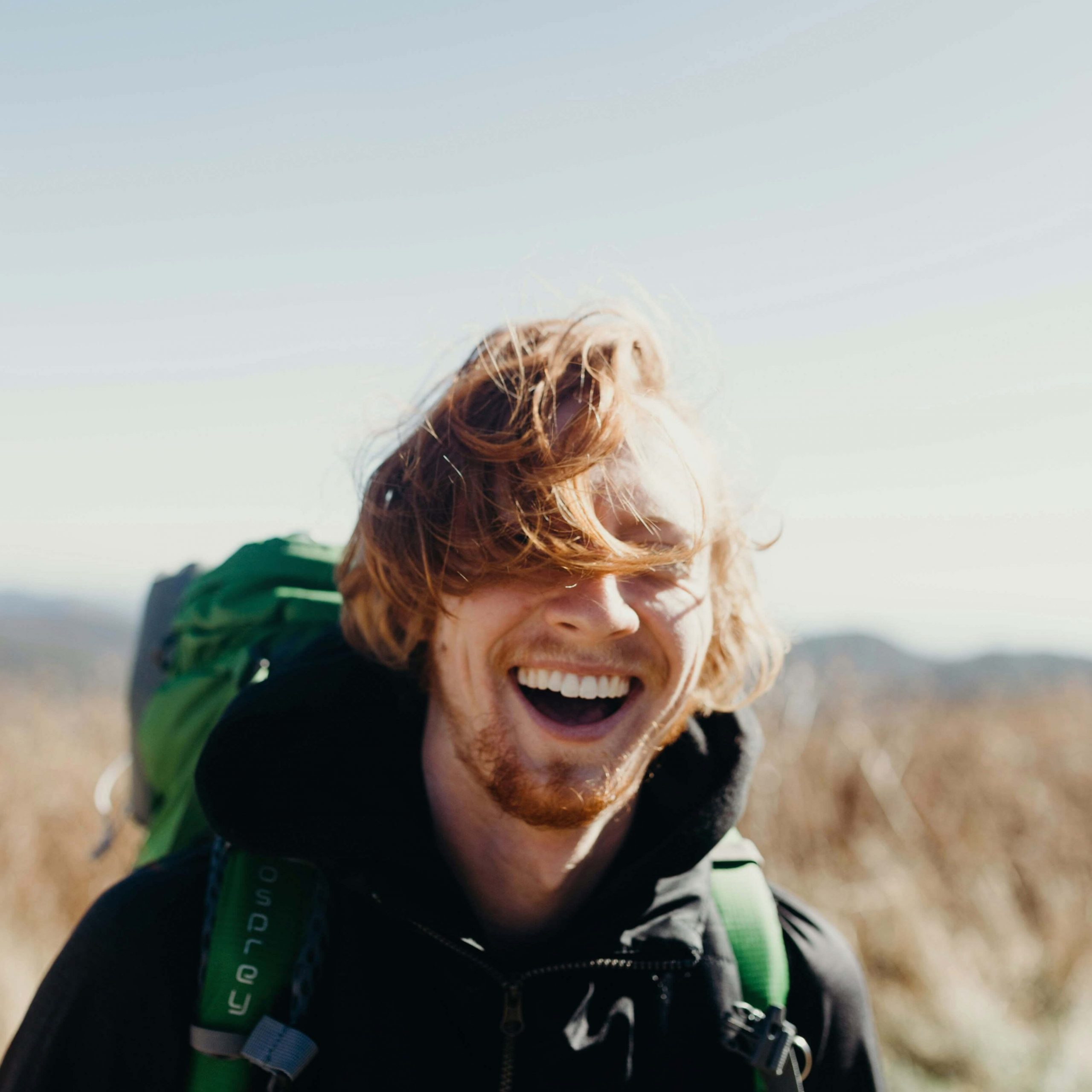 smiling man | neurofeedback therapy in denver, co | neurofeedback therapy in littleton, co | neurofeedback therapy | neurofeedback therapy for anxiety | adhd neurofeedback | neurofeedback and anxiety | 80126 | 80129 | 80130 Image of a smiling man hiking on a sunny day. If you struggle with anxiety, discover how neurofeedback therapy in Denver, CO can help you manage your symptoms.